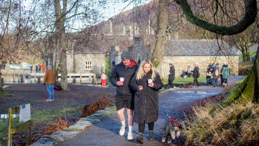 Visitors on a dog walk at Fell Foot, Lake District